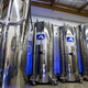 A row of dewars in Alcor’s Patient Care Bay. In addition to whole bodies, these dewars contain heads. (Image: Gizmodo)